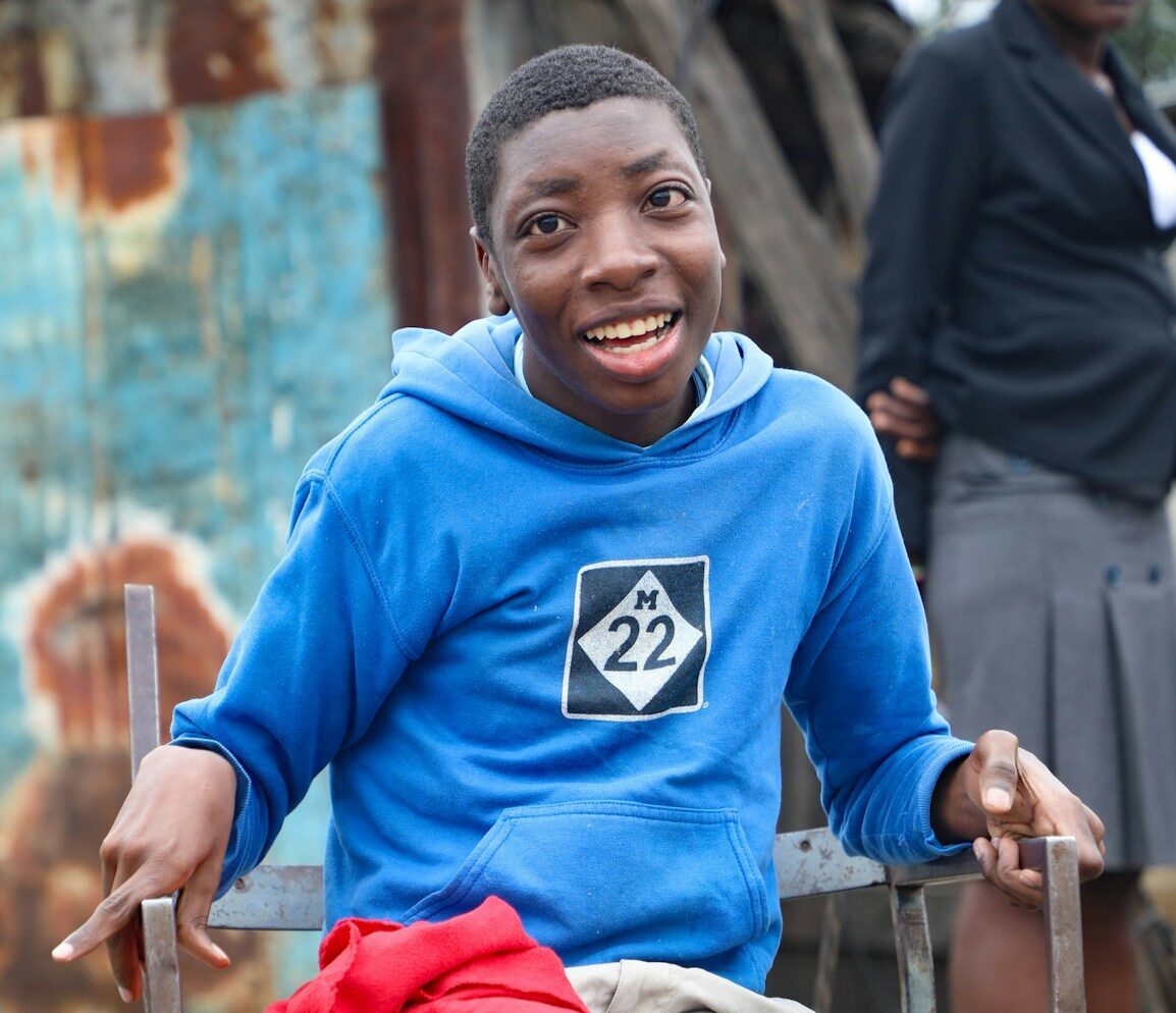 Happy young man smiles brightly in outdoor setting